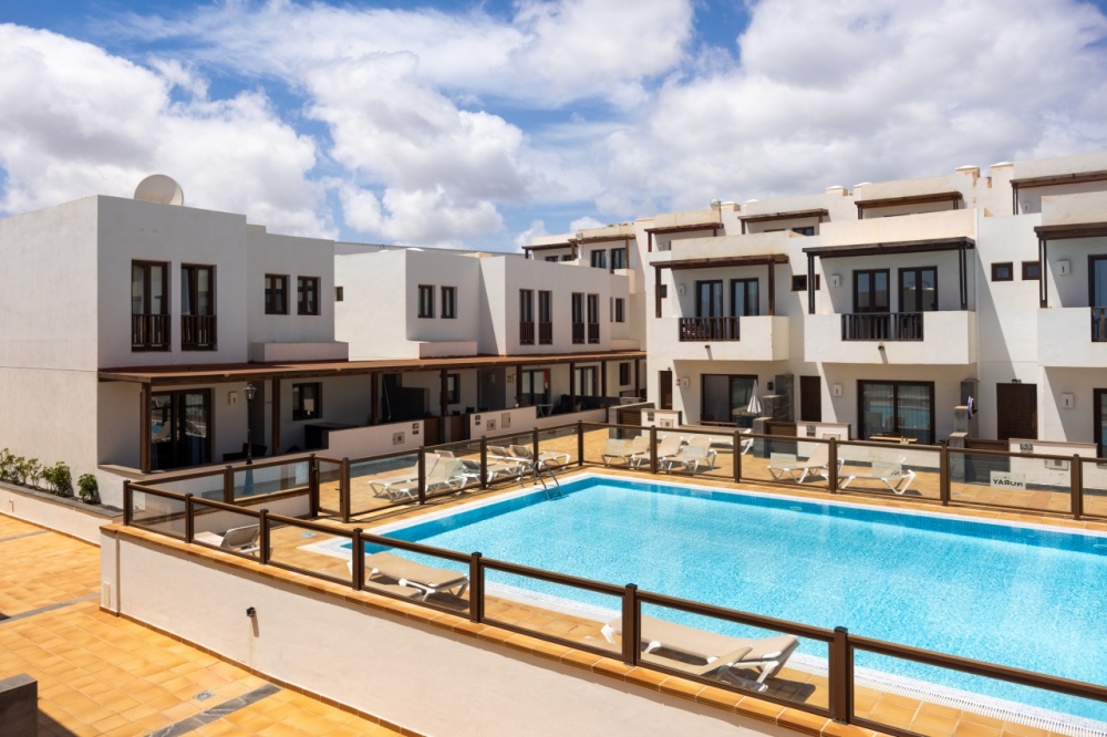 Stylish Duplex with Pool Views and Private Parking in Exclusive Puerto Calero - Puerto Calero - lanzaroteproperty.com